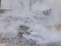 Fire halts garbage dumping