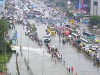 Mumbai tracks flooded, boats pull out 1,500 train passengers