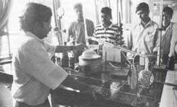 Scientists under a microscope