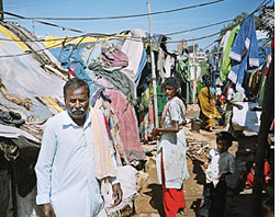 Land titles to urban slum dwellers in Bangalore  