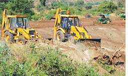 Bulldozers on crop